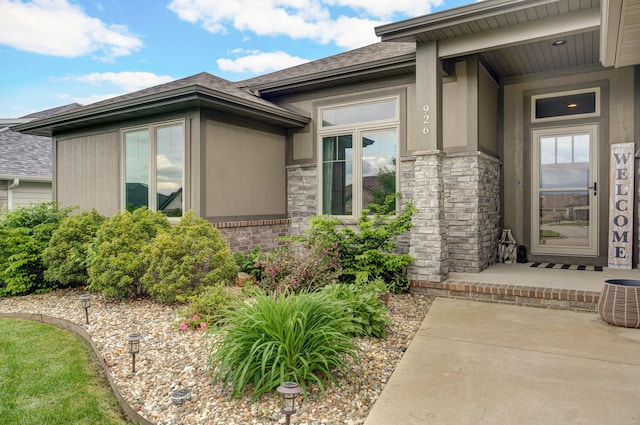 926 E Downshire Dr, Nixa, MO 65714 - property entrance with a shingled roof and stone siding