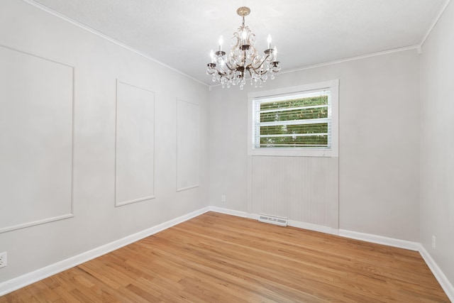 1722 S Link Ave, Springfield, MO 65804 - empty room featuring a chandelier, light wood finished floors, and crown molding