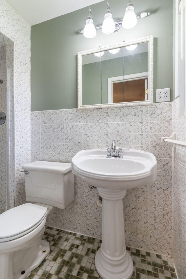1722 S Link Ave, Springfield, MO 65804 - bathroom with tile walls, a wainscoted wall, and a shower