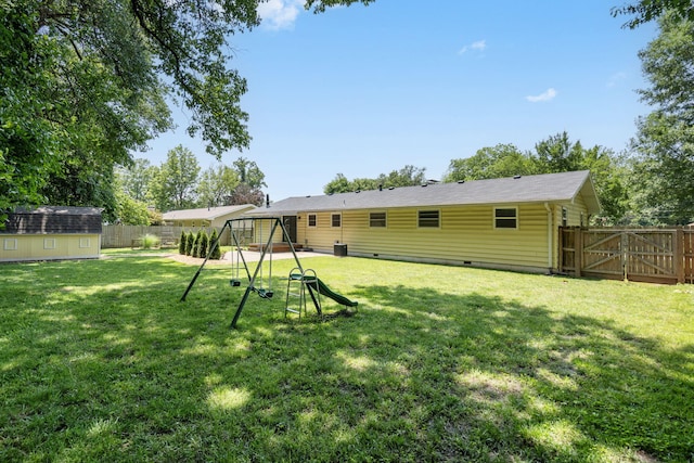 1722 S Link Ave, Springfield, MO 65804 - back of property featuring a playground, a fenced backyard, crawl space, a shed, and a gate