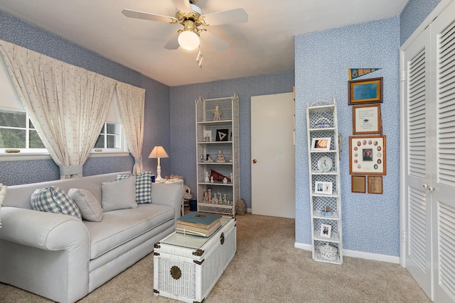 610 W Summit St, Bolivar, MO 65613 - living area featuring wallpapered walls, light carpet, and ceiling fan