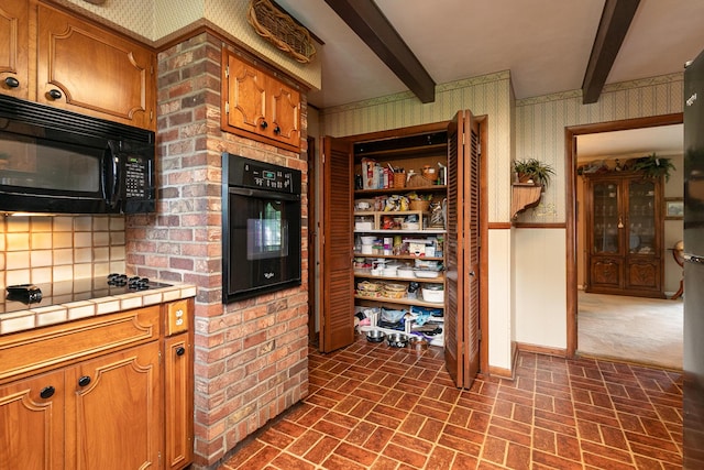 610 W Summit St, Bolivar, MO 65613 - kitchen with wallpapered walls, tile counters, black appliances, brick patterned floors, and beam ceiling