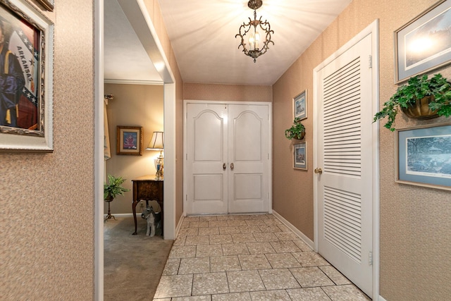 610 W Summit St, Bolivar, MO 65613 - foyer with light tile patterned floors and a chandelier