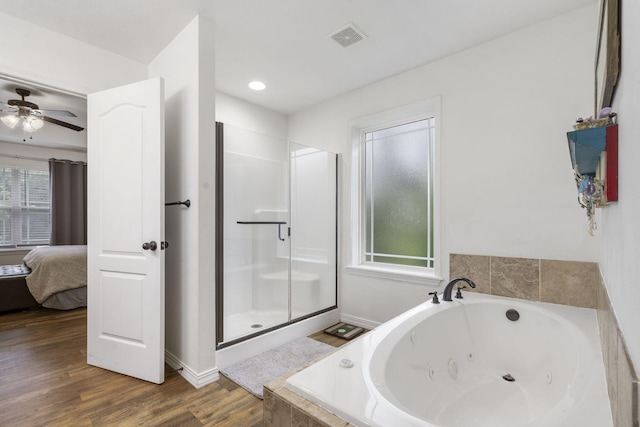 241 Everett Ml Rd, Branson, MO 65616 - bathroom featuring a tub with jets, connected bathroom, a shower stall, wood finished floors, and a ceiling fan