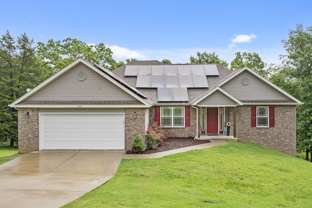 241 Everett Ml Rd, Branson, MO 65616 - view of front of home featuring a front lawn, brick siding, an attached garage, driveway, and solar panels