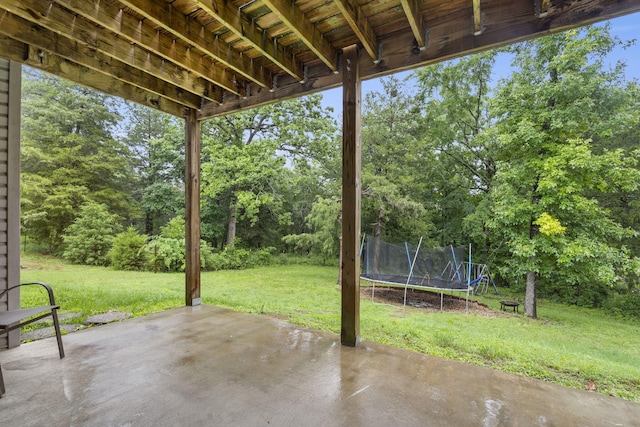 241 Everett Ml Rd, Branson, MO 65616 - view of patio / terrace with a trampoline and view of scattered trees