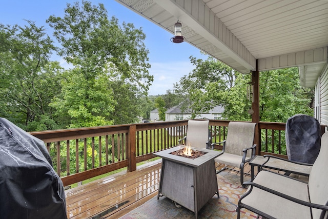 241 Everett Ml Rd, Branson, MO 65616 - wooden terrace featuring a fire pit