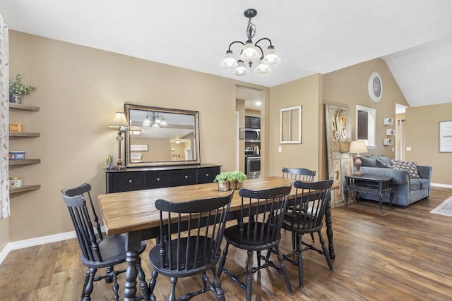 241 Everett Ml Rd, Branson, MO 65616 - dining space with dark wood-style floors, a chandelier, and lofted ceiling
