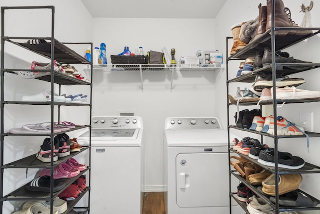 241 Everett Ml Rd, Branson, MO 65616 - washroom with washer and clothes dryer and wood finished floors