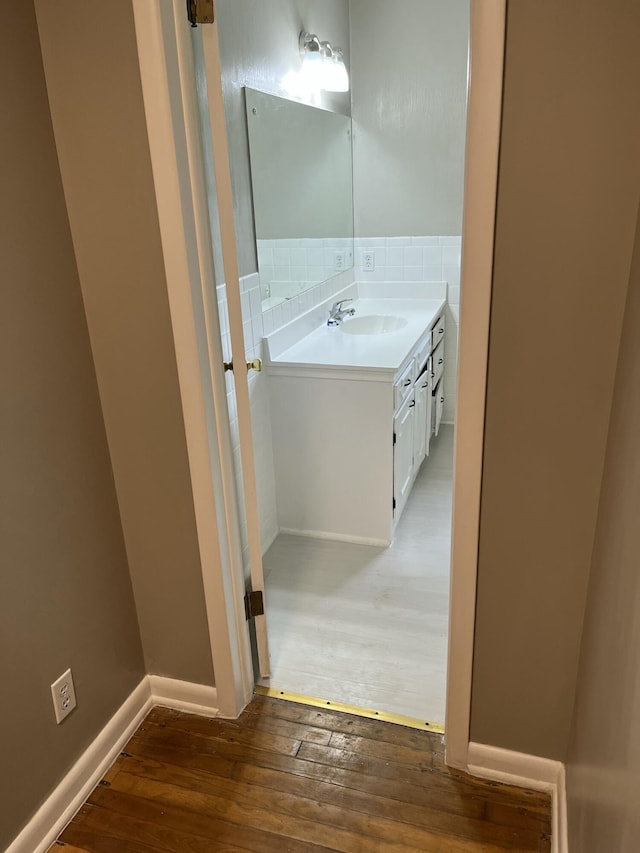 1955 S Fort Ave, Springfield, MO 65807 - bathroom featuring hardwood / wood-style flooring and vanity