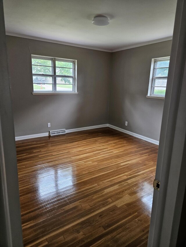 1955 S Fort Ave, Springfield, MO 65807 - unfurnished room with dark wood finished floors and crown molding