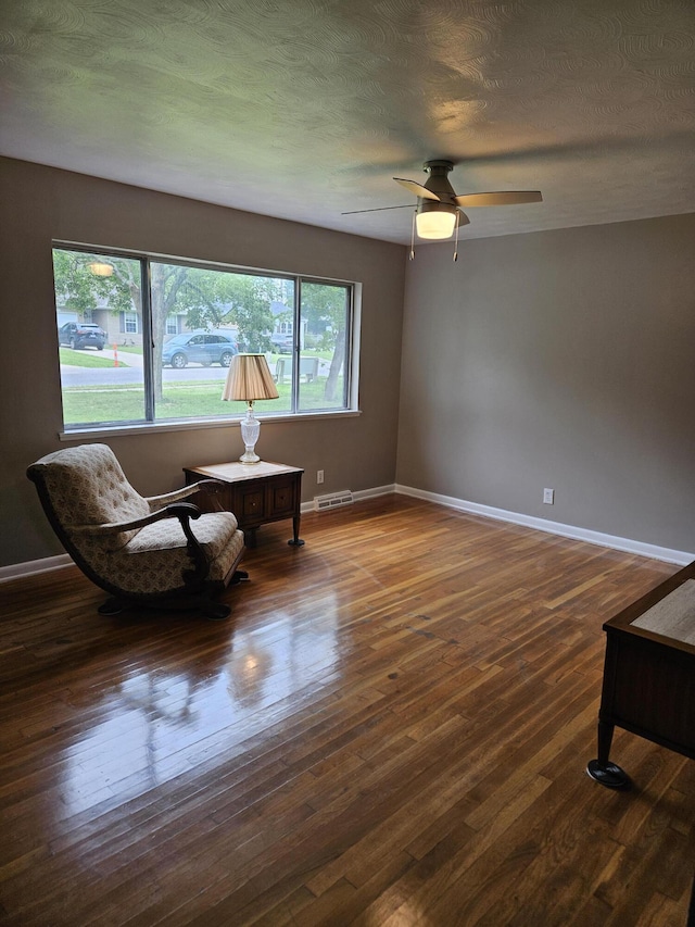1955 S Fort Ave, Springfield, MO 65807 - living area with dark wood-style flooring and a ceiling fan