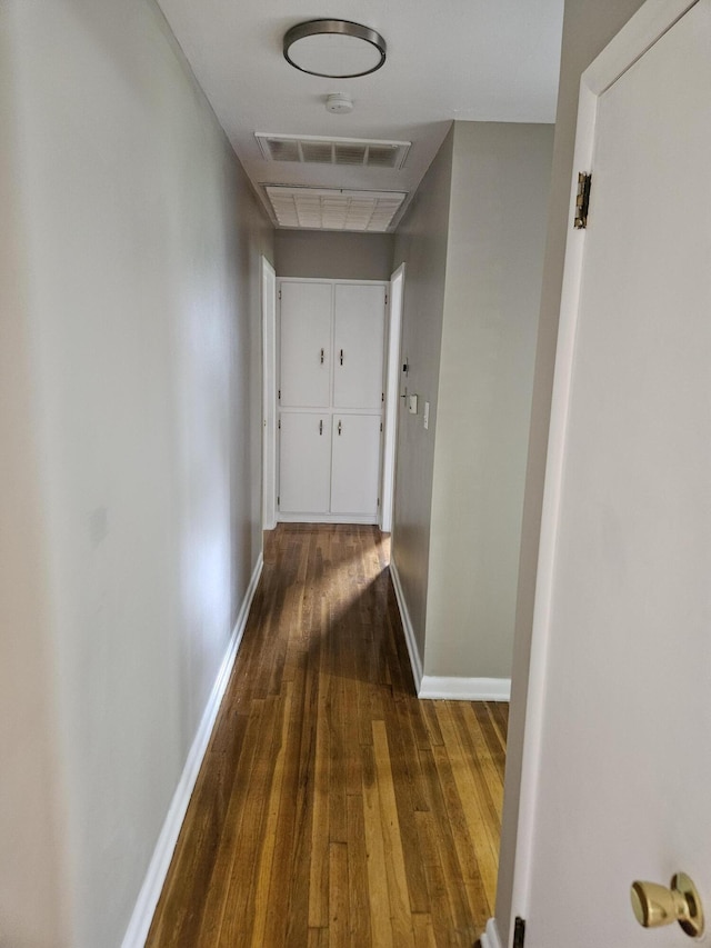 1955 S Fort Ave, Springfield, MO 65807 - hall featuring dark wood-style floors and baseboards