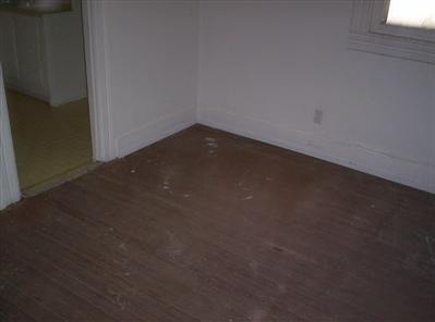 447 S New, Springfield, MO 65806 - unfurnished bedroom with wood finished floors and a closet