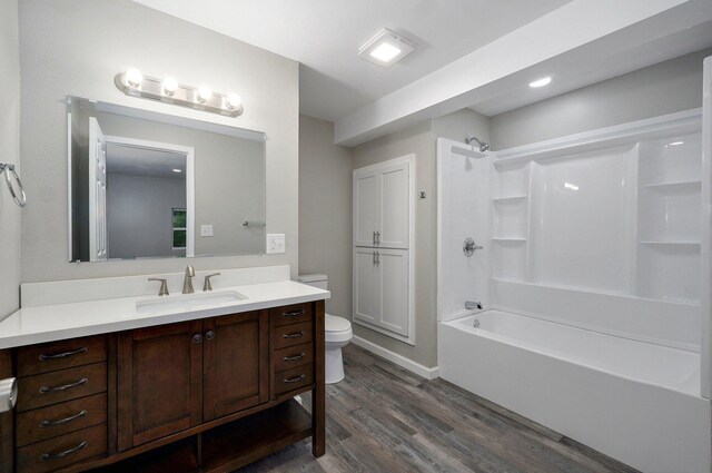 4852 S Fremont Ave, Springfield, MO 65804 - full bathroom with wood finished floors, vanity, and shower / tub combination