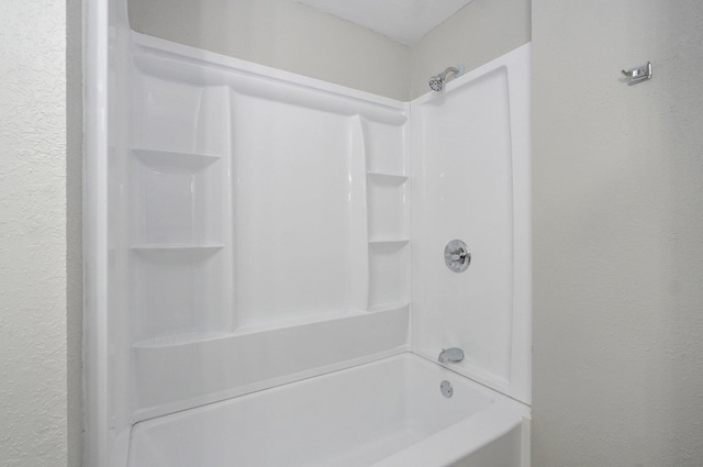 4852 S Fremont Ave, Springfield, MO 65804 - full bathroom featuring a textured wall and shower / bathtub combination