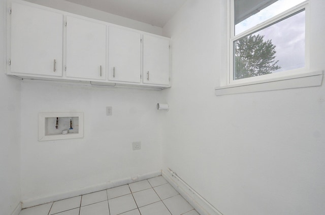 4852 S Fremont Ave, Springfield, MO 65804 - laundry room with cabinet space, washer hookup, and light tile patterned flooring
