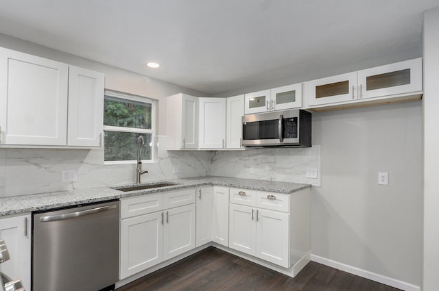 4852 S Fremont Ave, Springfield, MO 65804 - kitchen with stainless steel appliances, glass insert cabinets, light stone counters, white cabinets, and recessed lighting
