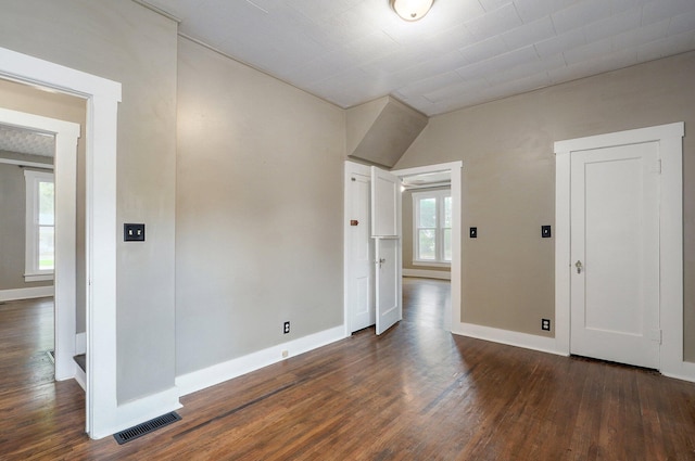 902 S Hickory St, Mount Vernon, MO 65712 - spare room featuring dark wood-style flooring and lofted ceiling