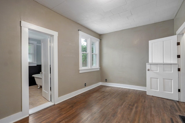 902 S Hickory St, Mount Vernon, MO 65712 - unfurnished room with wood finished floors and baseboards