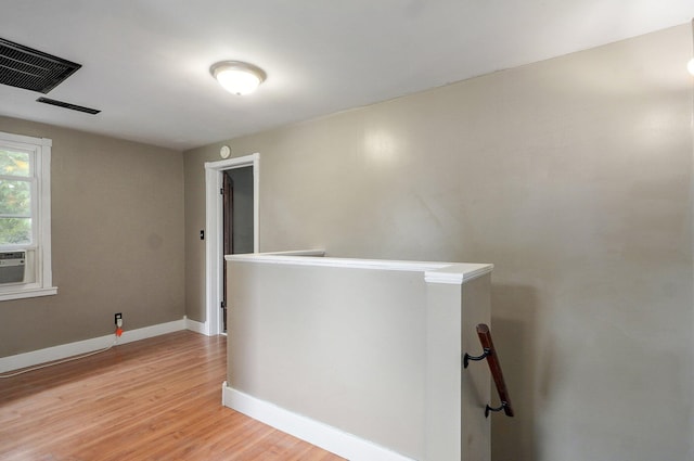 902 S Hickory St, Mount Vernon, MO 65712 - hallway featuring an upstairs landing, light wood-type flooring, and cooling unit