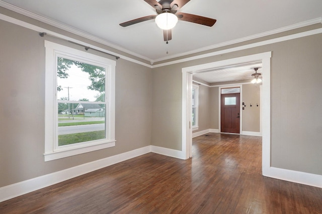 902 S Hickory St, Mount Vernon, MO 65712 - spare room with dark wood-style flooring, ornamental molding, and a ceiling fan