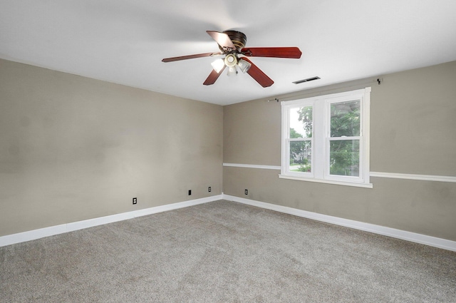 902 S Hickory St, Mount Vernon, MO 65712 - empty room with a ceiling fan and carpet floors
