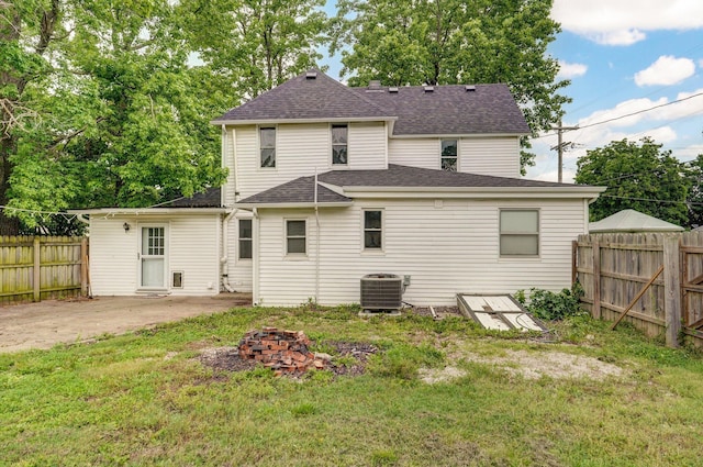 902 S Hickory St, Mount Vernon, MO 65712 - back of property featuring a patio, an outdoor fire pit, and a shingled roof