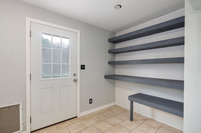 902 S Hickory St, Mount Vernon, MO 65712 - doorway to outside featuring light tile patterned flooring and baseboards