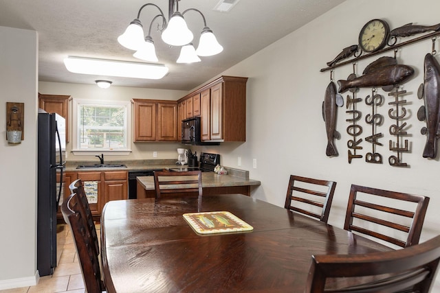 2529 State Highway 176 Unit F2, Rockaway Beach, MO 65740 - dining space featuring a chandelier