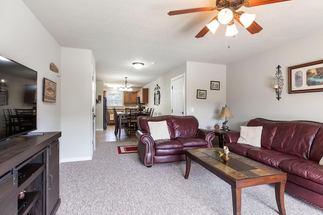 2529 State Highway 176 Unit F2, Rockaway Beach, MO 65740 - living area with light colored carpet, a chandelier, and a ceiling fan