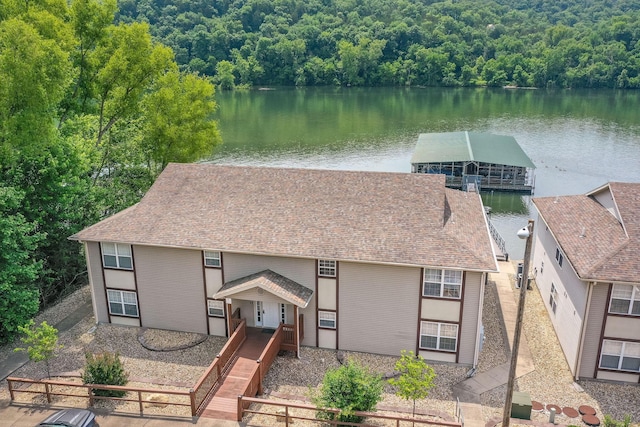 2529 State Highway 176 Unit F2, Rockaway Beach, MO 65740 - view of front of house featuring a water view, a forest view, and a shingled roof