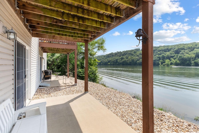 2529 State Highway 176 Unit F2, Rockaway Beach, MO 65740 - view of patio / terrace with a forest view and a water view