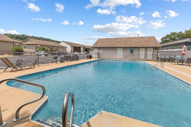 2529 State Highway 176 Unit F2, Rockaway Beach, MO 65740 - community pool with a patio and a residential view