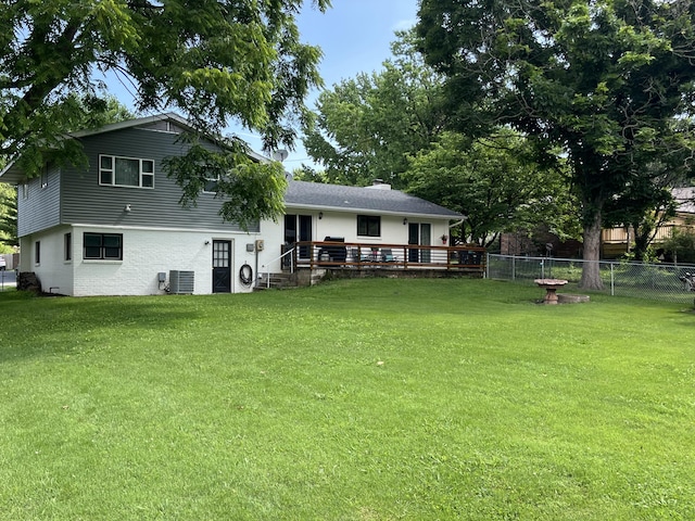 508 E Kirkwood Dr, Aurora, MO 65605 - rear view of property with a fenced backyard, a wooden deck, and a chimney