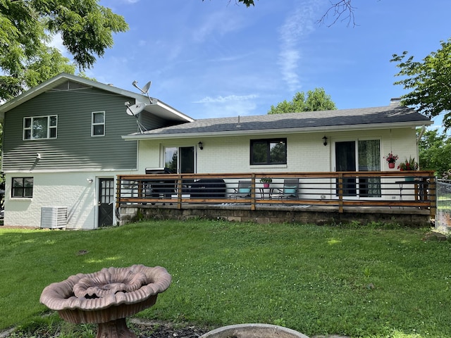 508 E Kirkwood Dr, Aurora, MO 65605 - back of property featuring brick siding, a yard, a deck, and roof with shingles