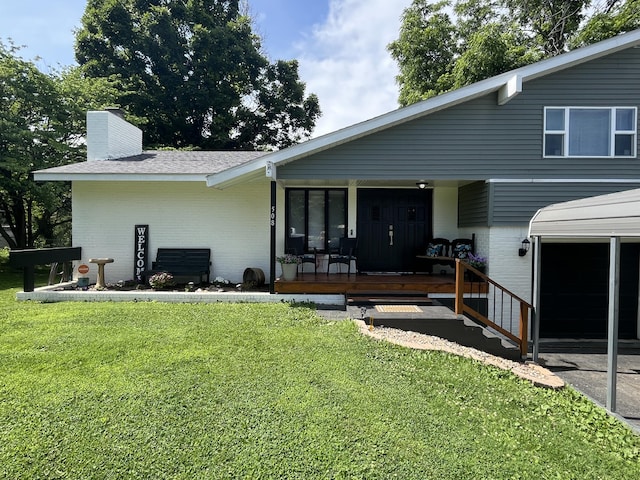 508 E Kirkwood Dr, Aurora, MO 65605 - back of property with brick siding, a yard, and a chimney