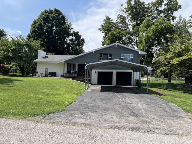 508 E Kirkwood Dr, Aurora, MO 65605 - view of front facade featuring asphalt driveway, a carport, and a chimney