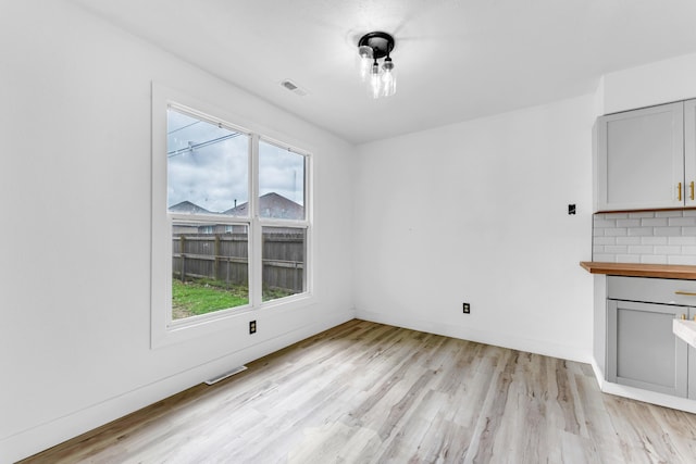 2564 S Regina Ave, Springfield, MO 65807 - unfurnished dining area featuring light wood-type flooring