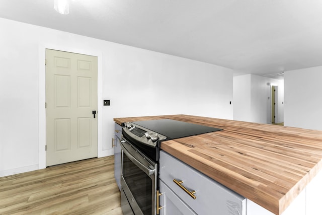 2564 S Regina Ave, Springfield, MO 65807 - kitchen featuring electric range, wood counters, and light wood finished floors