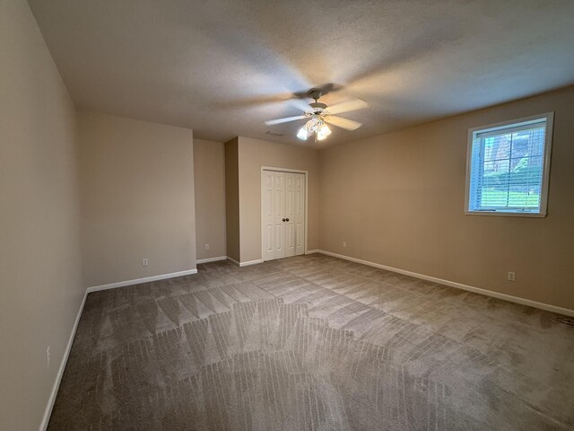 5218 S Gary Ct, Springfield, MO 65810 - unfurnished bedroom with carpet floors, a closet, and a ceiling fan