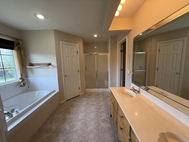 5218 S Gary Ct, Springfield, MO 65810 - full bath featuring a shower stall, double vanity, a garden tub, tile patterned floors, and recessed lighting