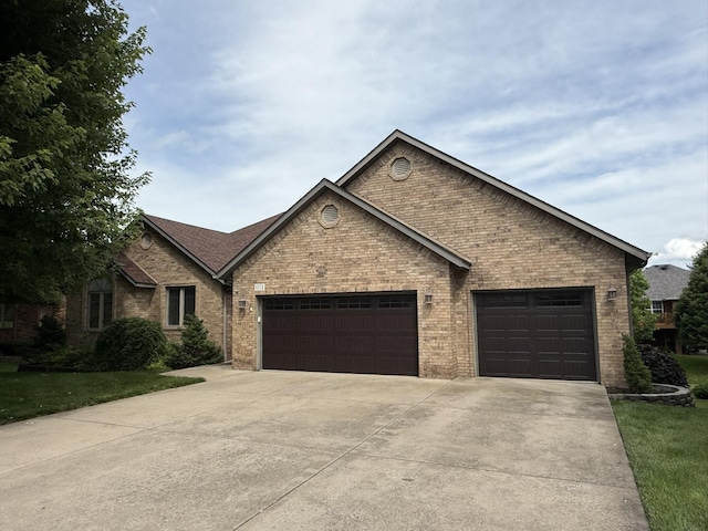 5218 S Gary Ct, Springfield, MO 65810 - view of front of property featuring concrete driveway, a garage, brick siding, and a front yard