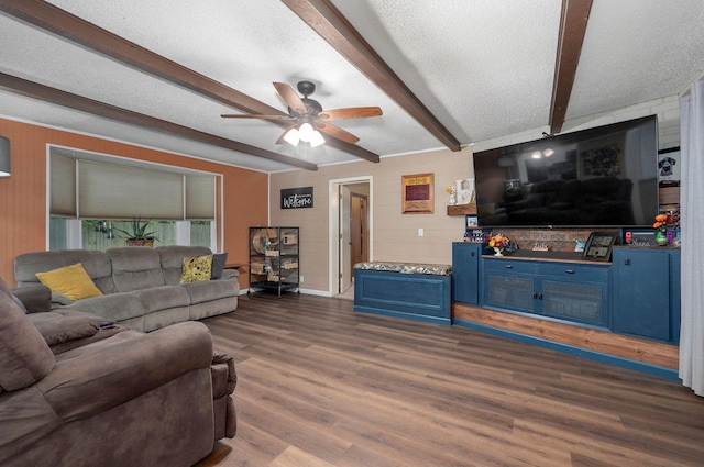 3449 N Rogers Ave, Springfield, MO 65803 - living area featuring a ceiling fan, beamed ceiling, wood finished floors, a textured ceiling, and wood walls