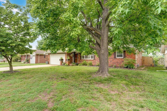 3449 N Rogers Ave, Springfield, MO 65803 - view of property hidden behind natural elements featuring concrete driveway, an attached garage, and brick siding