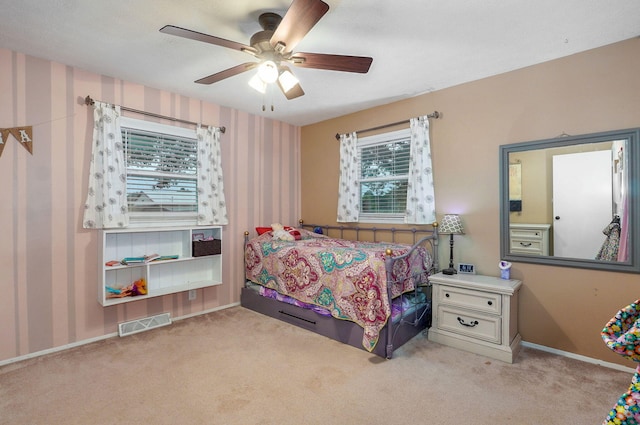 3449 N Rogers Ave, Springfield, MO 65803 - bedroom with light colored carpet, wallpapered walls, and ceiling fan