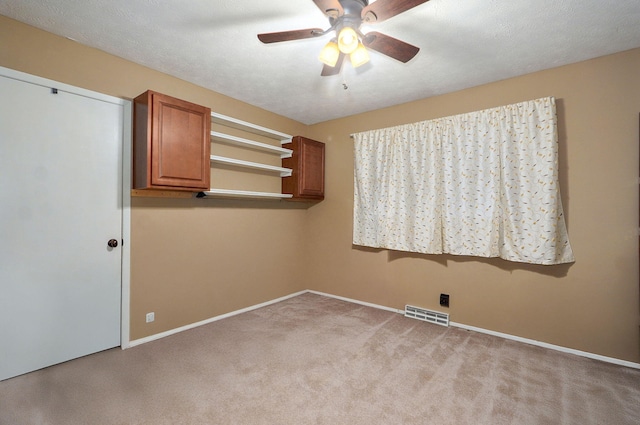 3449 N Rogers Ave, Springfield, MO 65803 - carpeted spare room featuring a ceiling fan and baseboards