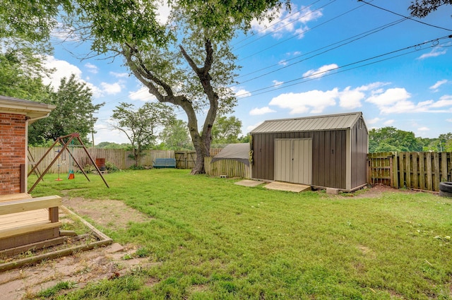 3449 N Rogers Ave, Springfield, MO 65803 - fenced backyard featuring a shed and a playground