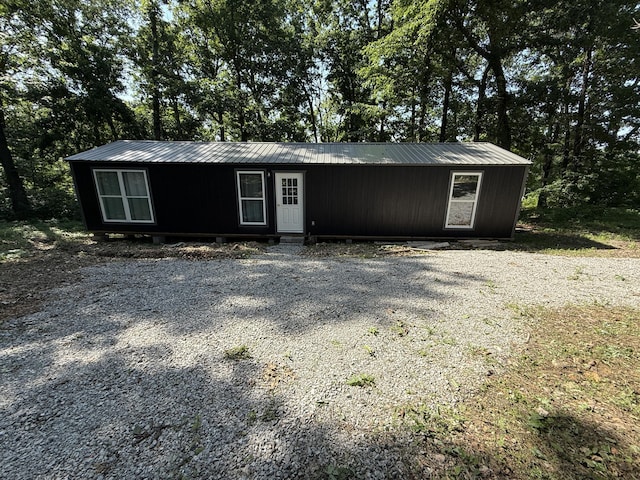5641 State Highway K, Pineville, MO 64856 - view of front facade with a metal roof and view of wooded area