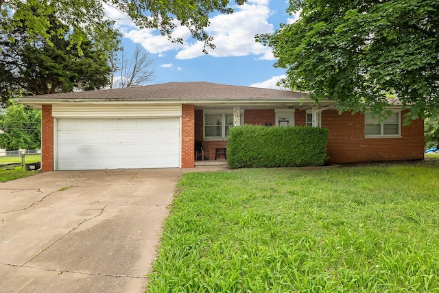 2215 E Sharon, Springfield, MO 65803 - single story home featuring brick siding, an attached garage, driveway, and a front lawn